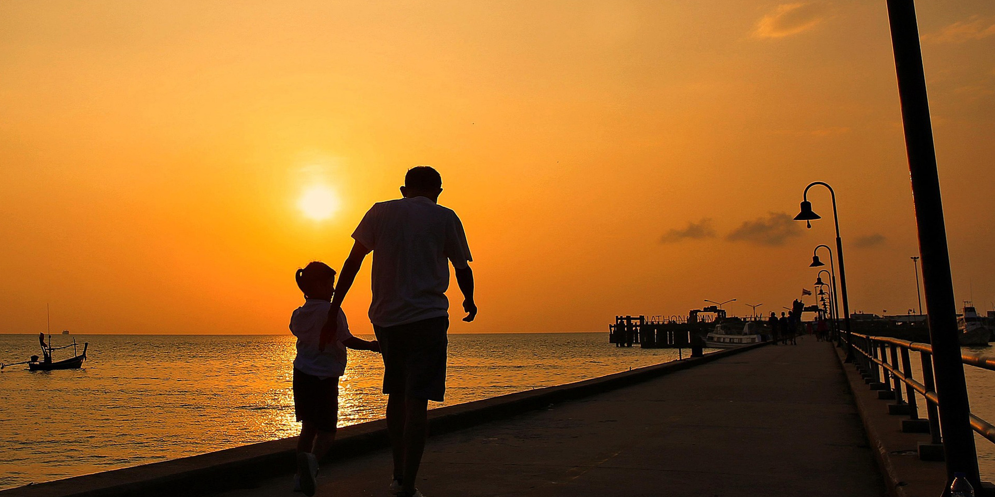 A father and child on a beach